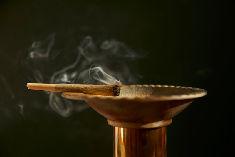 A pre rolled cannabis joint on an ashtray