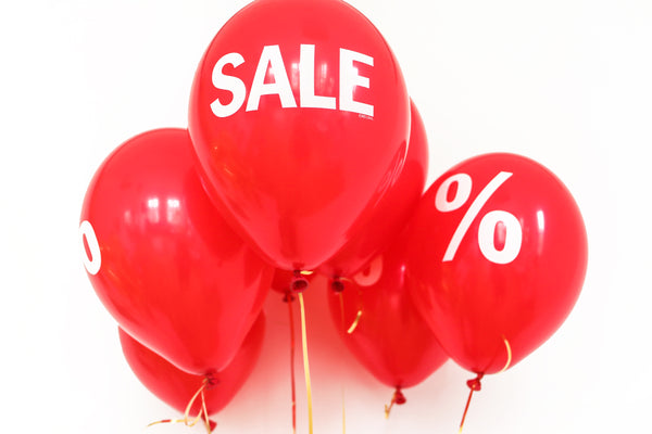 Red balloons promoting a sale